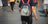 Person carrying a kitten in a pet carrier backpack