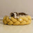 Hand-woven cotton rope pet bed in lemon yellow