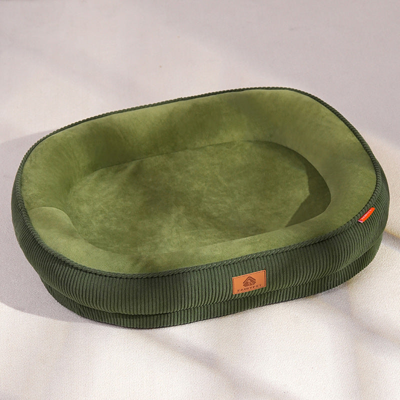 Green oval corduroy pet bed with non-slip base, photo 4