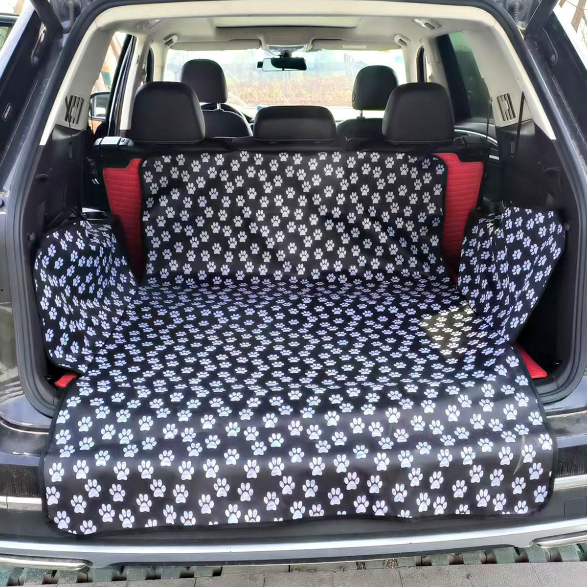 Waterproof dog boot liner with orange edge in a car