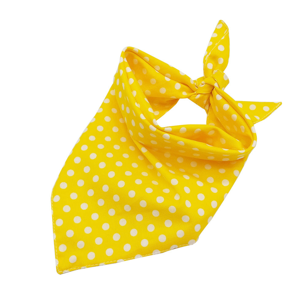 Double-sided dot cotton pet bib in Red Dot, in a home setting