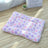 Cat sleeping on a pink rabbit coral fleece blanket