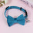 Striped cat collar with velvet bow, close-up detail view