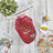 Fleece lined aviator dog jacket with leather-look shell in Red, in a home setting