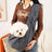 Grey pet sling shoulder bag carrying a small dog