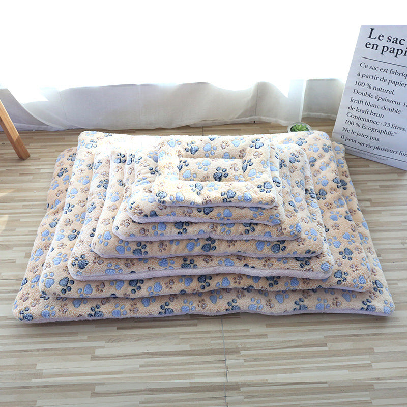 Cat sleeping on a pink rabbit coral fleece blanket