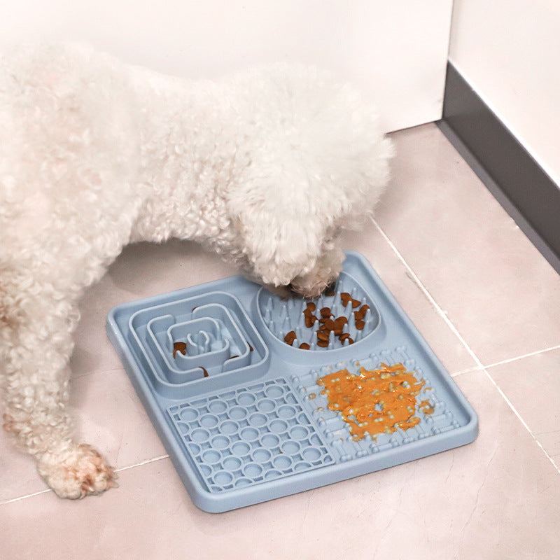 Dog licking a rectangular silicone slow feeder mat