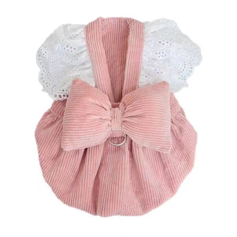 Pink corduroy pumpkin skirt pet dress with bow in Pink Corduroy, in a home setting