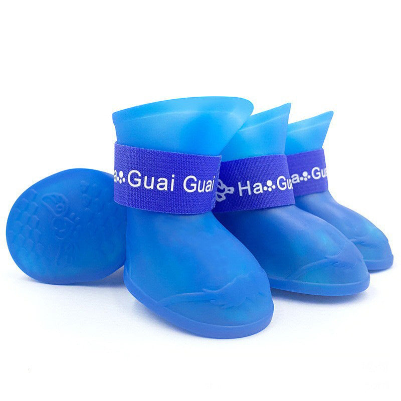 Waterproof silicone dog rain boots with non-slip soles in Yellow, in use with a pet