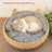Brown rattan woven pet bed with blue cushion for cats, view 1