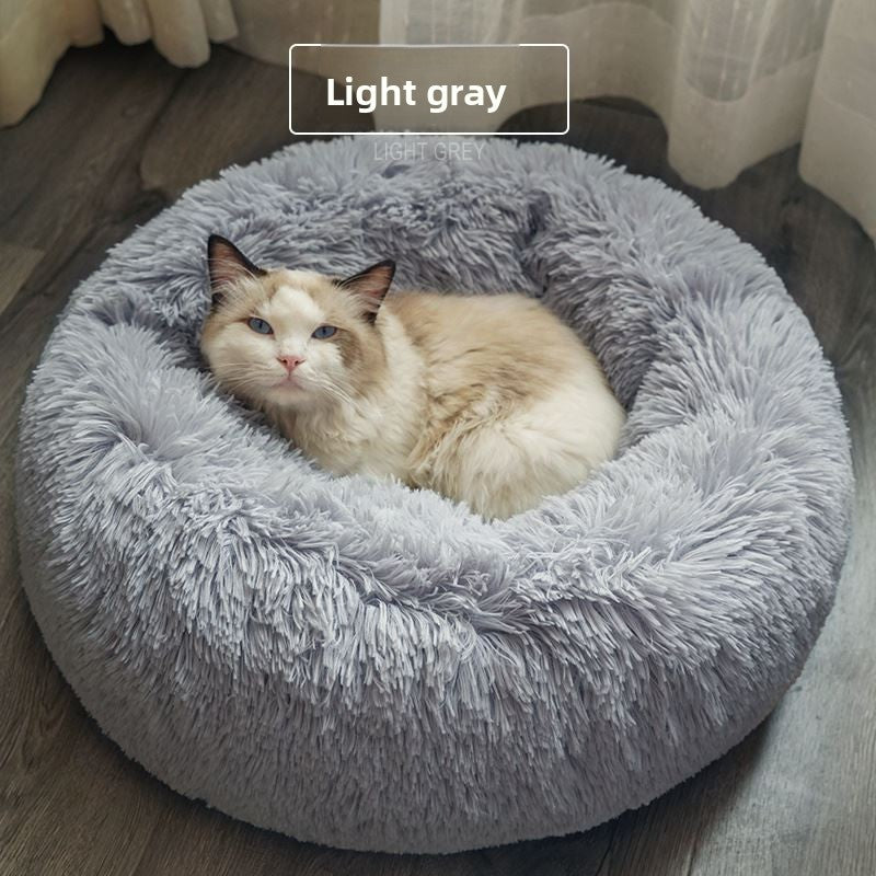 Round plush donut cat bed with raised rim, view 9