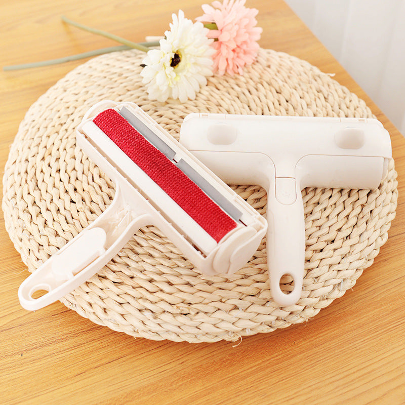 Cat ear pet hair remover brush lifting hair from a sofa