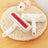 Cat ear pet hair remover brush lifting hair from a sofa
