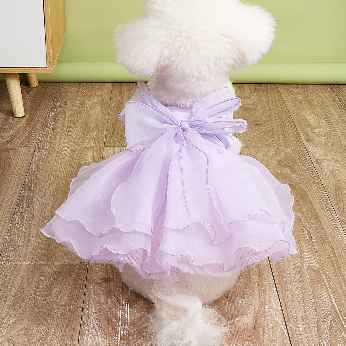 Small dog in a pink layered tutu princess dress