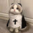 Cat dressed in a funny pumpkin head Halloween costume