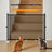 Foldable mesh pet gate barrier across a doorway