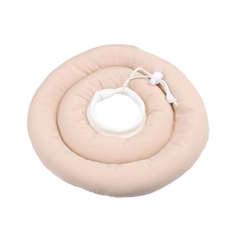 Soft padded recovery cone in light pink on a cat