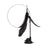 Kitten pouncing on a feather cat teaser toy during playtime - photo 5