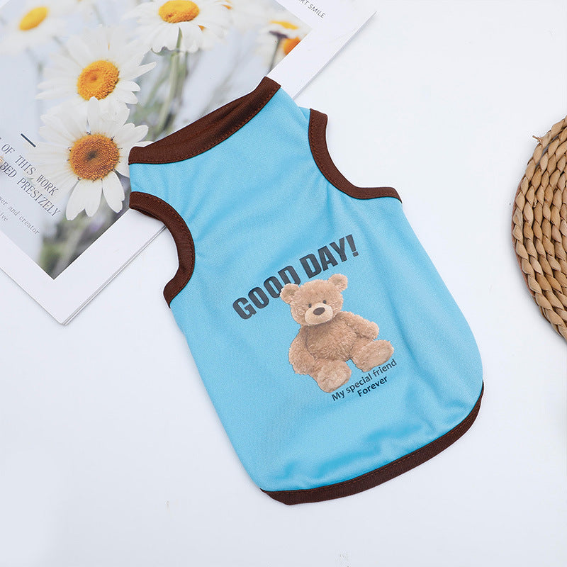 Small dog wearing a light blue striped summer vest