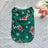 Lightweight Christmas dog vest in breathable polyester in Black White Tree, in a home setting