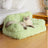 Small dog sleeping on a peach pink velvet pet sofa bed