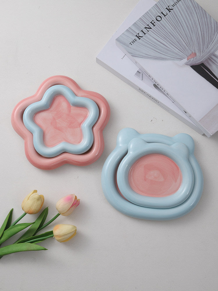Shallow ceramic pet food plate with cute bear design in blue and pink, view 2