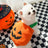Pumpkin Halloween costume for dogs and cats, in a home setting