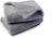 Dusty pink soft pet throw on a sofa