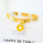 Floral cat collar with bell and safety buckle in Yellow, in a home setting