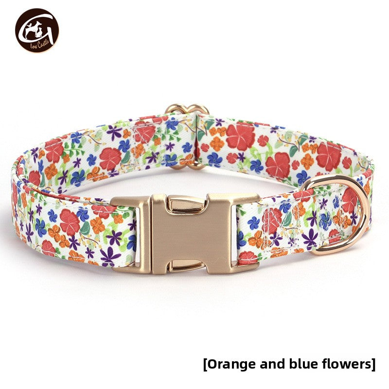 Floral fabric dog collar with gold buckle, showing size and shape
