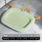 Cat lying on a green waterproof cooling pad