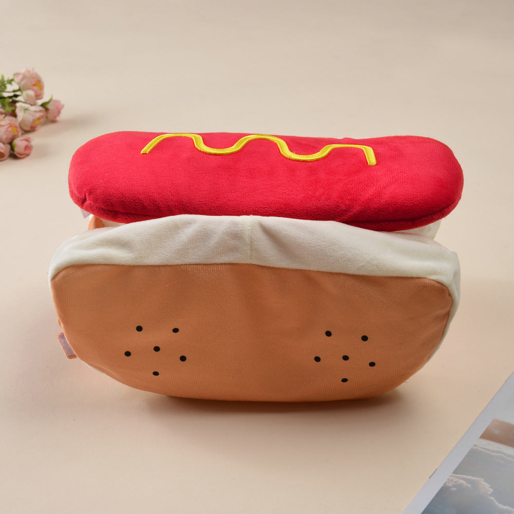 Small dog dressed in a funny frankfurter jacket costume