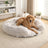Plush round donut bed for cats and dogs, close-up detail view