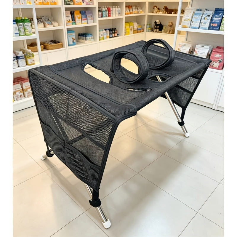 Folded pet bathing table in khaki and black for compact storage