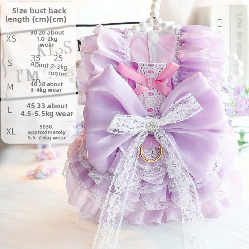 Small dog wearing a pink cotton princess dress