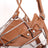 Brown leather dog muzzle with chrome frame in four sizes