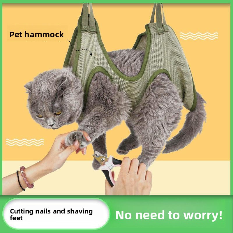 Cat suspended in a blue grooming hammock for nail trimming