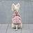 Water-resistant padded dog winter jacket in Khaki, in a home setting