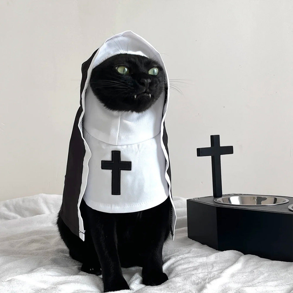 Small dog wearing a funny nun costume T-shirt
