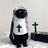 Small dog wearing a funny nun costume T-shirt