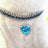 Rhinestone elastic pet collar with charm in Blue Bone, showing size and shape