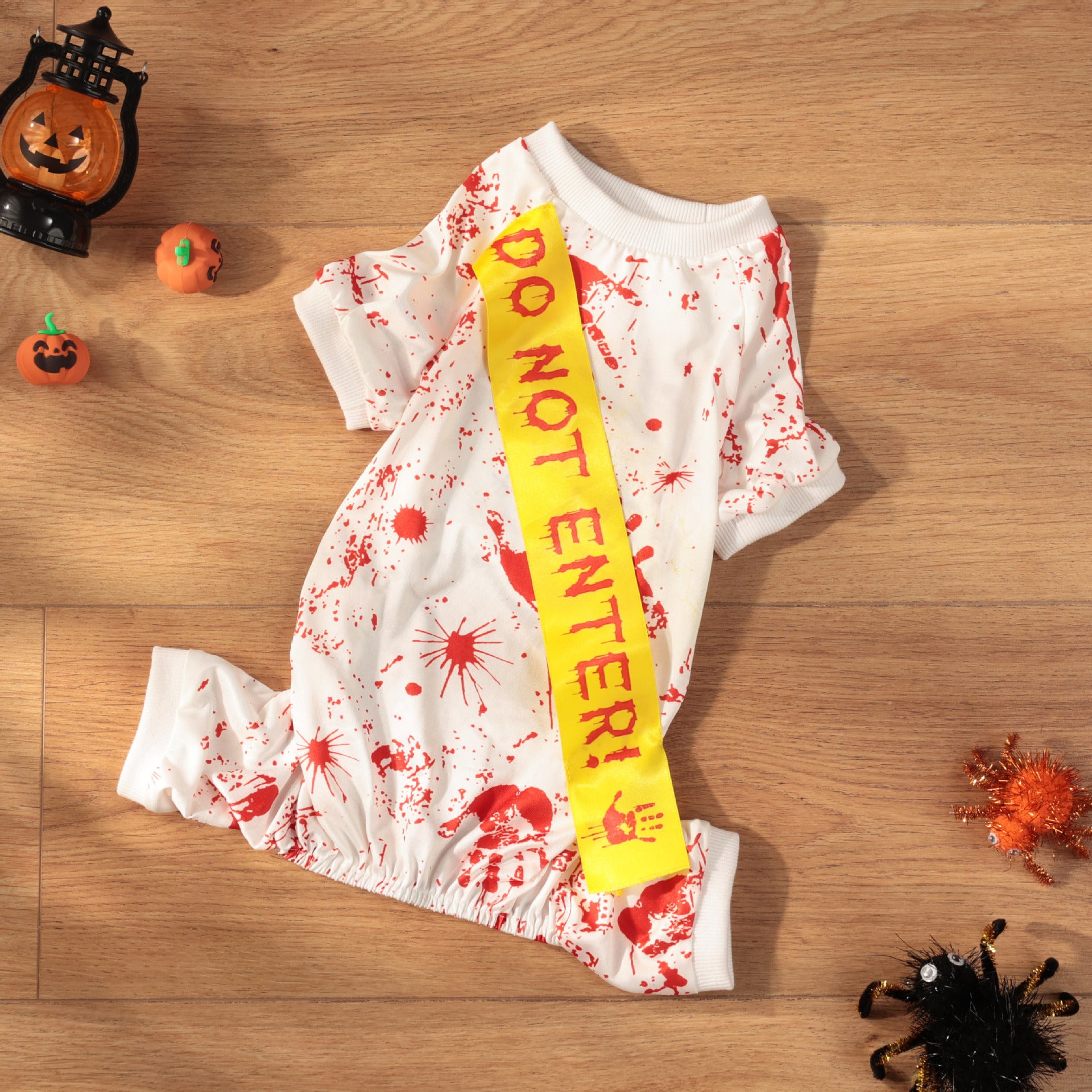 Small dog wearing a blood splatter print Halloween costume