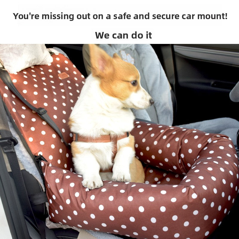 Small dog travelling in a grey plaid car seat bed