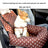 Small dog travelling in a grey plaid car seat bed