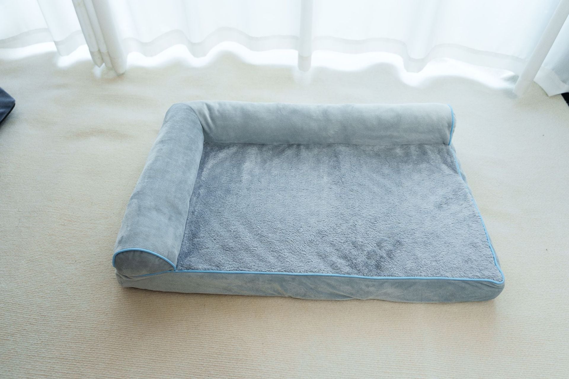 Blue plush cat bed in medium size with soft cover