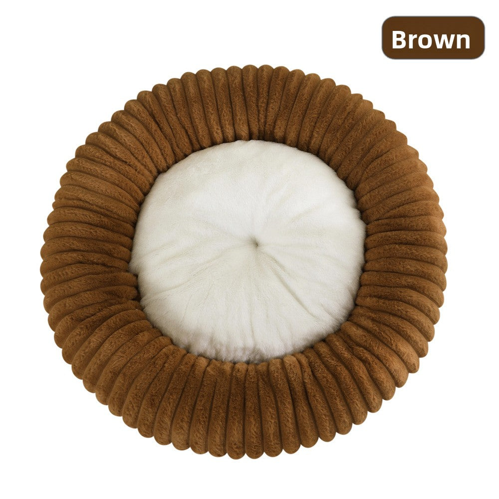 Small dog curled up in a khaki striped faux fur bed