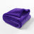 Dog lying on a beige flannel and fleece waterproof throw