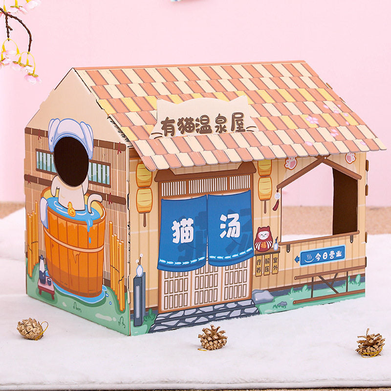 Cat scratching inside a themed cardboard scratcher house