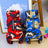 Small dog in a red camo four leg reflective coat