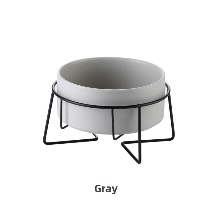 Raised glazed ceramic pet bowl on a stand in pastel yellow, view 10